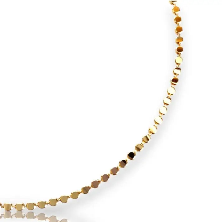 Arabella Dot Anklet styled gold anklet with delicate details on white background close up
