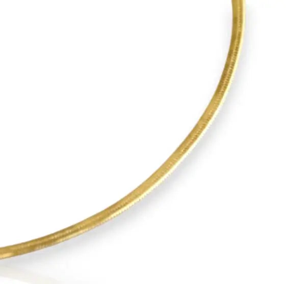 Gold herringbone anklet on a white background