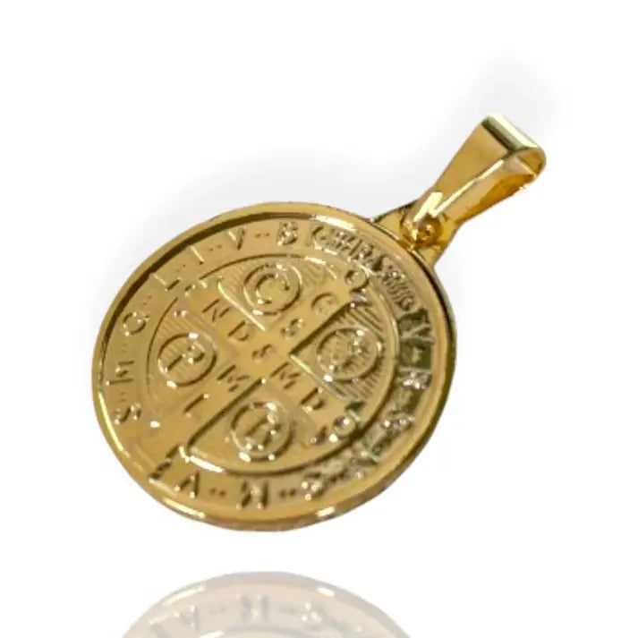 A gold-colored St. Benedict pendant necklace on an 18k gold filled box chain.