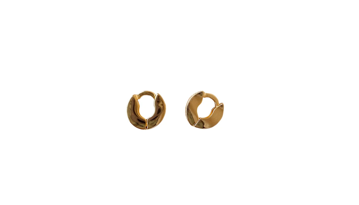 Gold hoop earrings on a white background