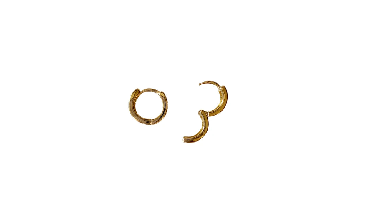 Pair of gold hoop earrings on a white background
