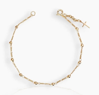 Blessed Gold Cross Bracelet gold bracelet styled on white back ground