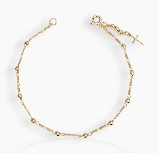 Blessed Gold Cross Bracelet gold bracelet styled on white back ground