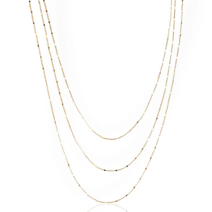 A gold curb chain necklace with a sleek, modern design, displayed against a white background.