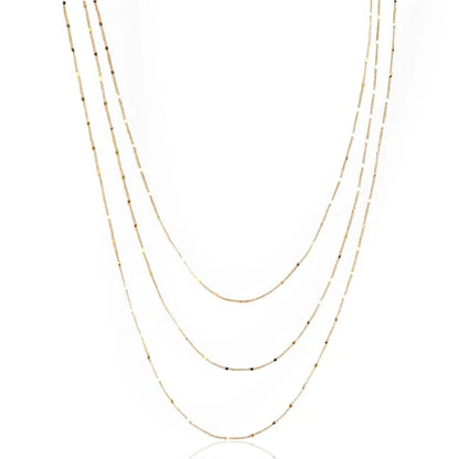 A gold curb chain necklace with a sleek, modern design, displayed against a white background.