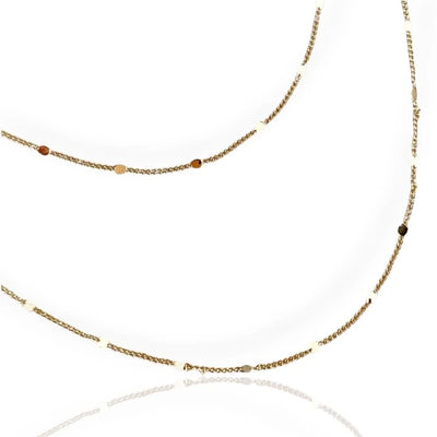 A gold curb chain necklace with a sleek, modern design, displayed against a white background.