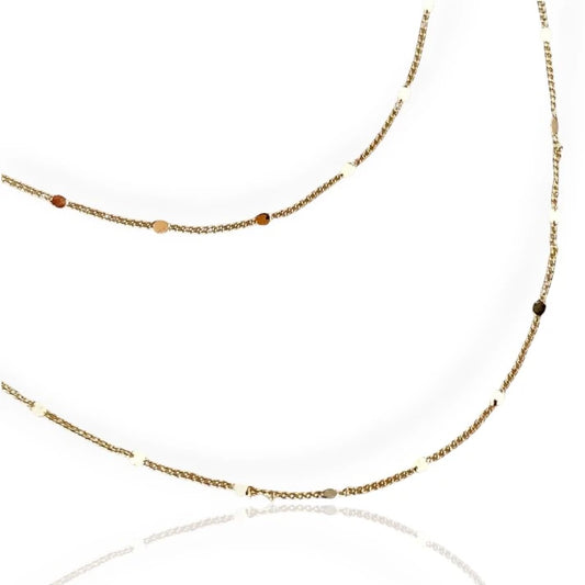 A gold curb chain necklace with a sleek, modern design, displayed against a white background.