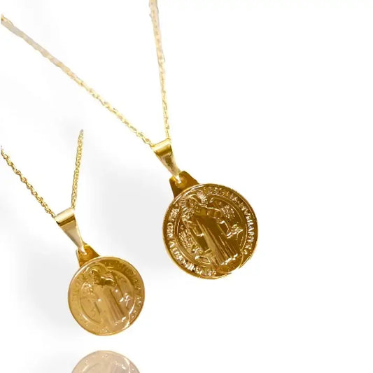 A gold-colored St. Benedict pendant in small and large size on a thin chain
